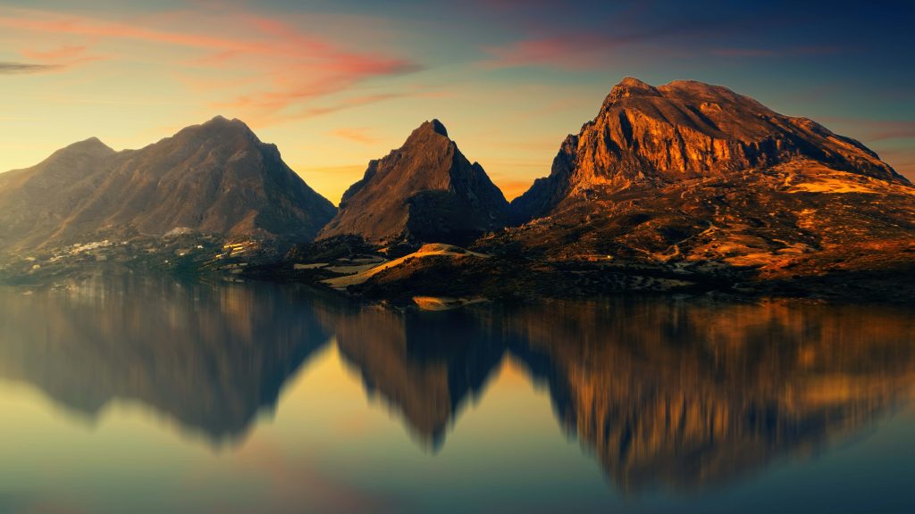 Sunset over Sicily's Mount Cofano peaks mirrored in calm water a serene nature wallpaper background