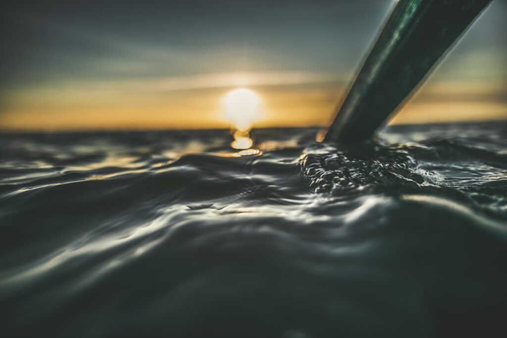 Serene Sunset Water Close-Up with Bubbles | Wallpaper Background