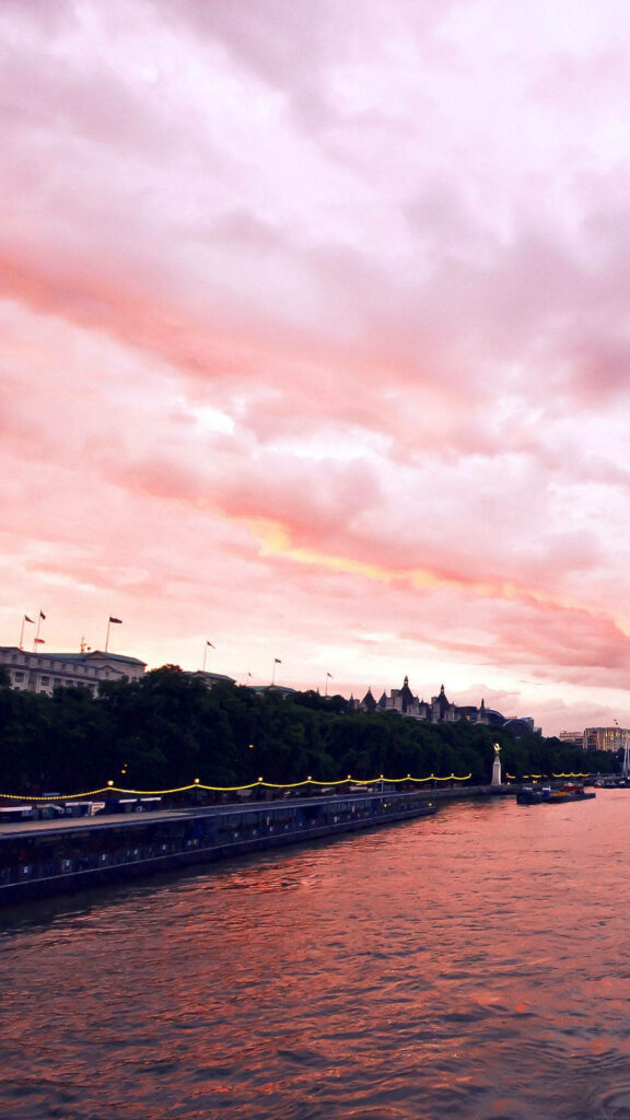 Serene Sunset Riverside Wallpaper: Rose Gold Aesthetic Background