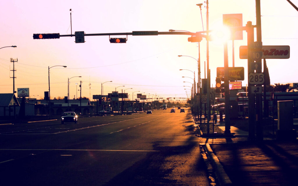 Serene Sunset Street Scene with Traffic Light - Warm Wallpaper Background