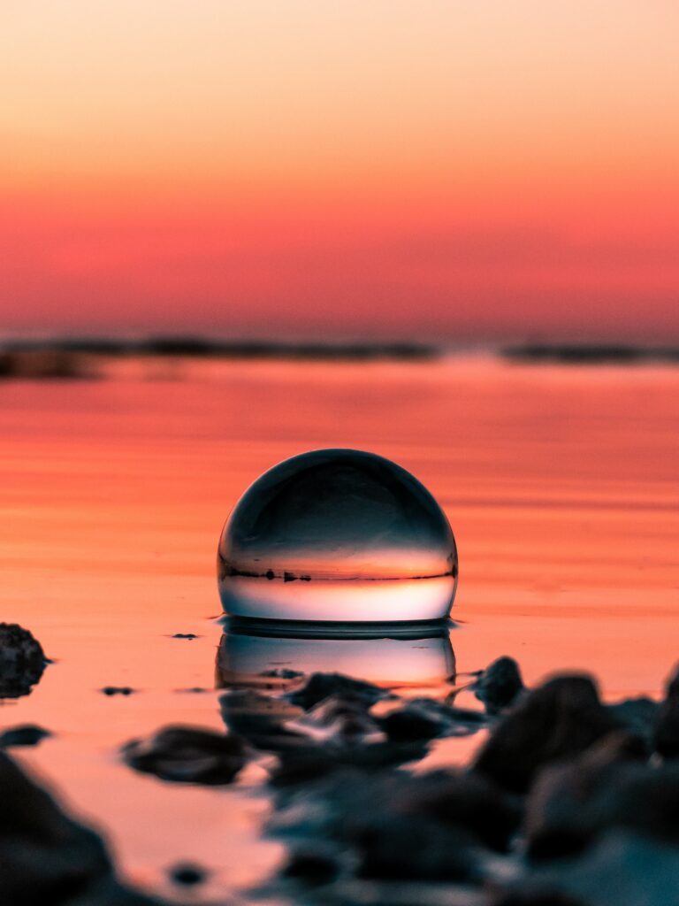 Serene Sunset Crystal Ball Wallpaper - Macro Reflection Background