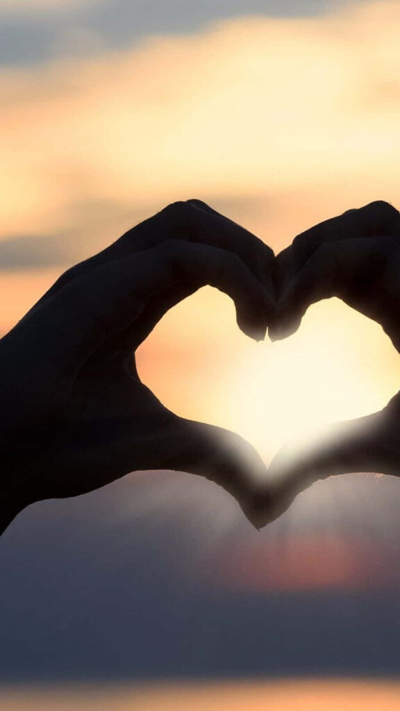 Heart-Shaped Hands & Sunset Wallpaper Background: Love & Unity