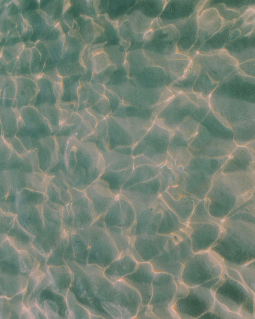 Serene Sunset Water Wallpaper: Calm Beach Vibes & Pastel Hues