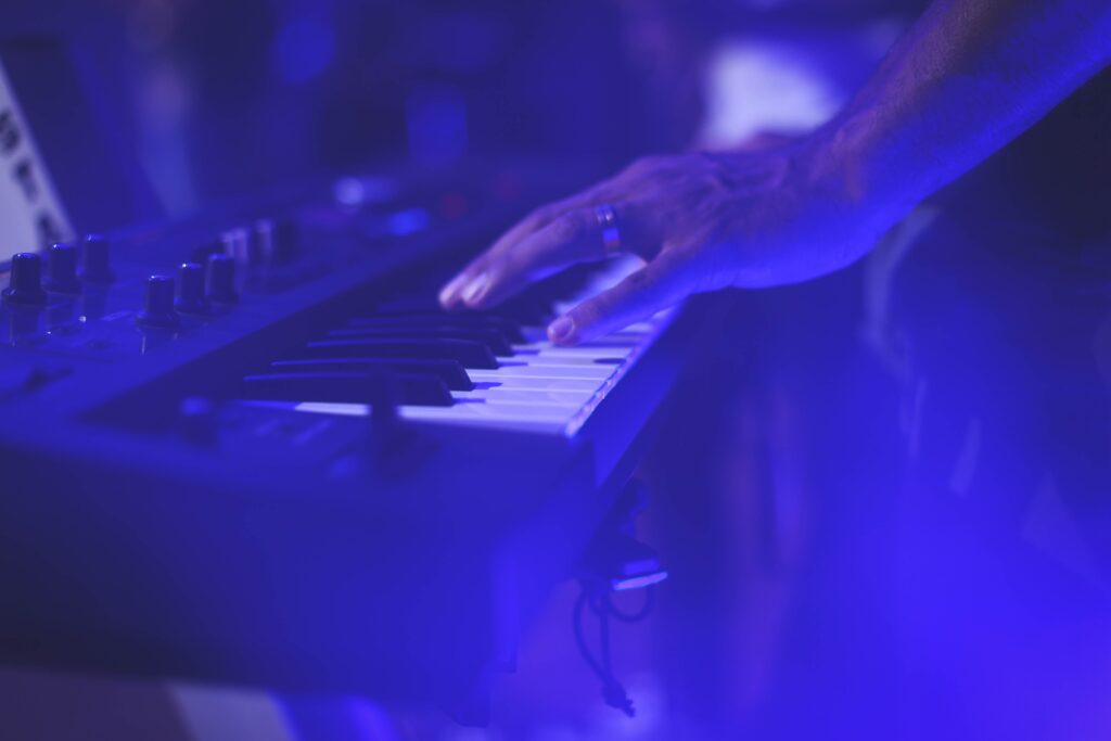 Vibrant Blue Synthesizer Wallpaper: Serene Musical Vibe Background