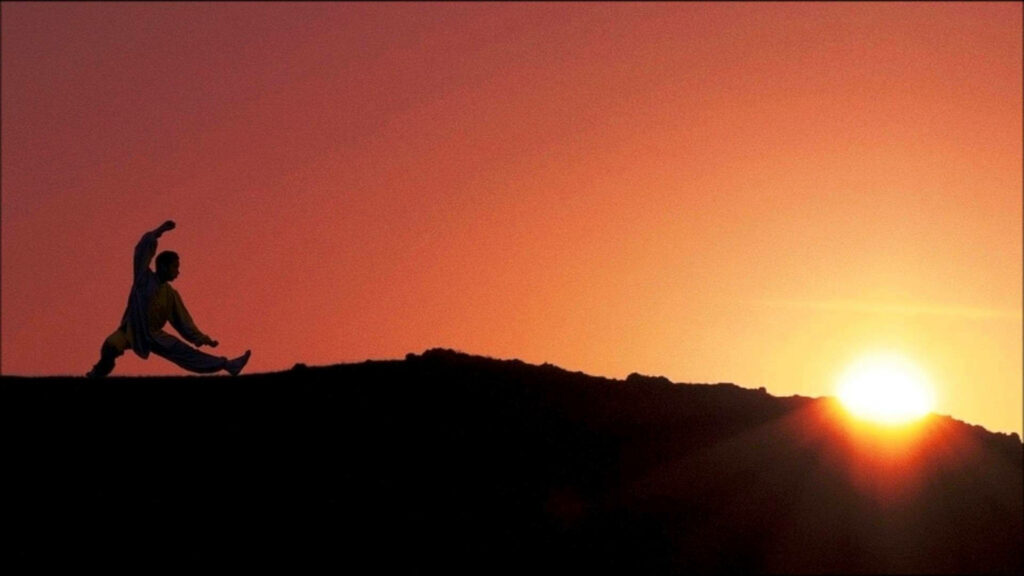 Serene Tai Chi Sunset Wallpaper: Calming Meditative Background