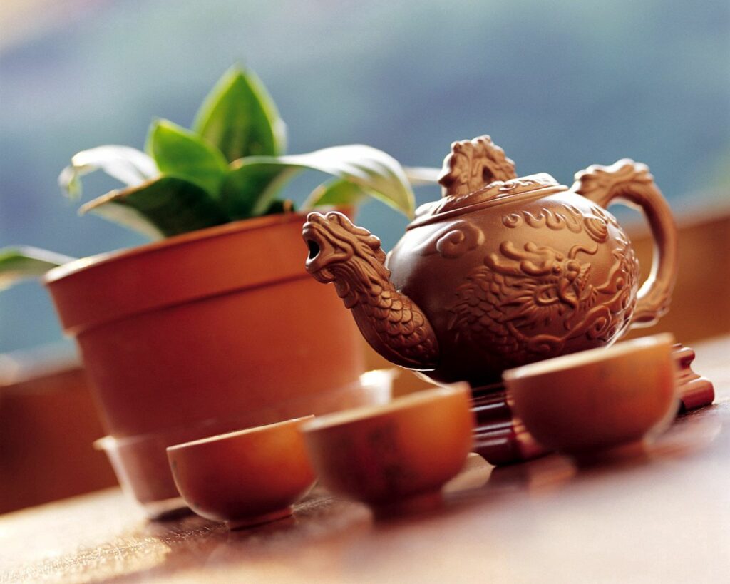 Elegant Teapot with Dragon Motifs - Serene Tea Setting Wallpaper