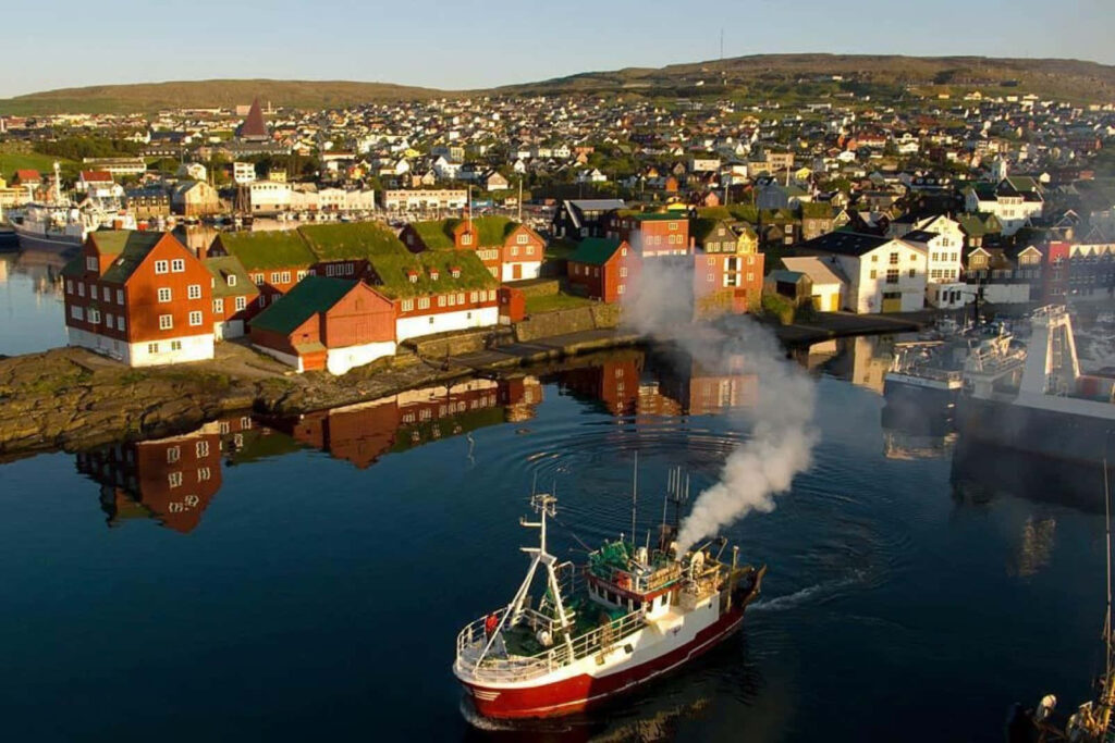 Serene Thorshavn Harbor Wallpaper: Colorful Buildings & Calm Waters