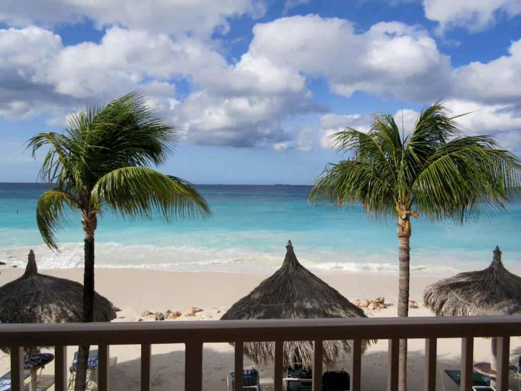 Serene Tropical Beach Wallpaper: Turquoise Waters & Palm Trees
