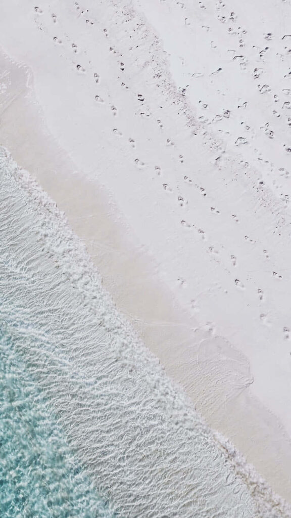 Tranquil Tropical Beach Wallpaper for Your iPhone Background