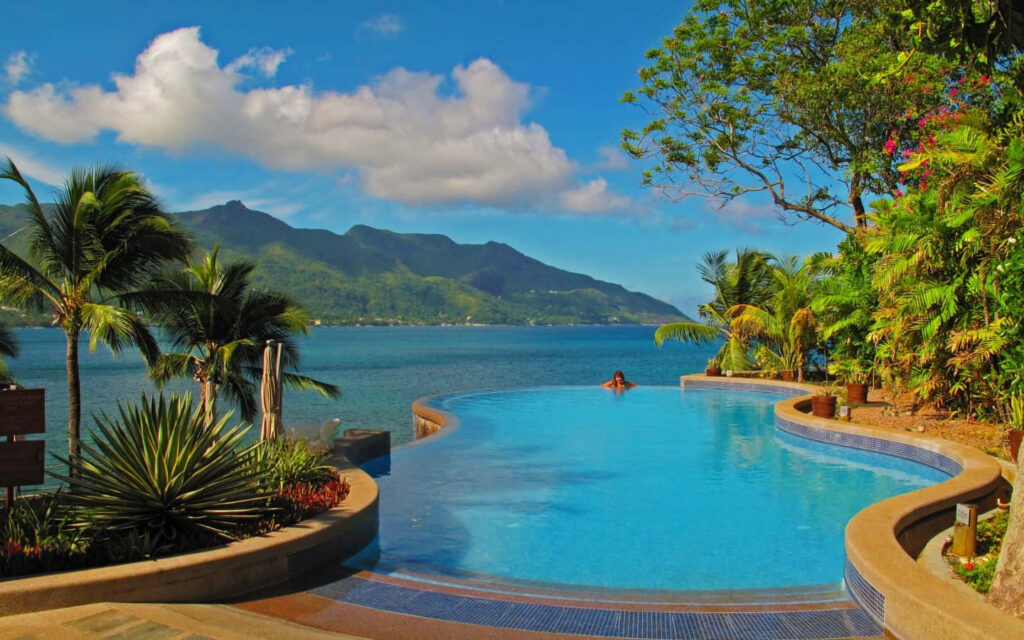 Serene Tropical Paradise Wallpaper with Infinity Pool & Ocean View