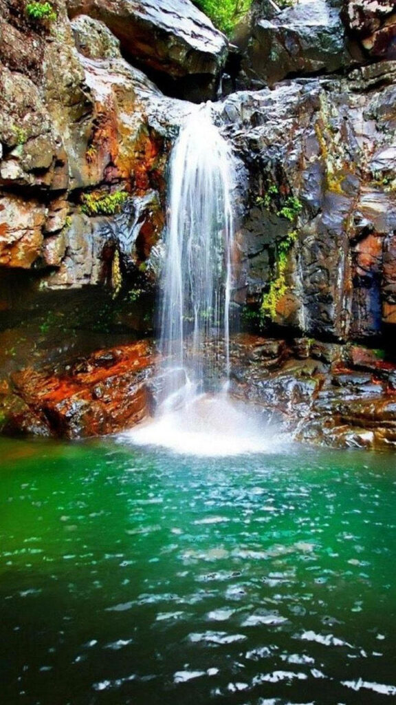Serene Turquoise Lagoon Wallpaper: Waterfall & Lush Greenery