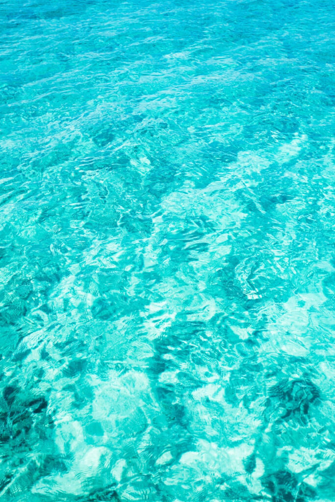 Serene Turquoise Water Ripple Wallpaper - Tranquil Aquatic Background