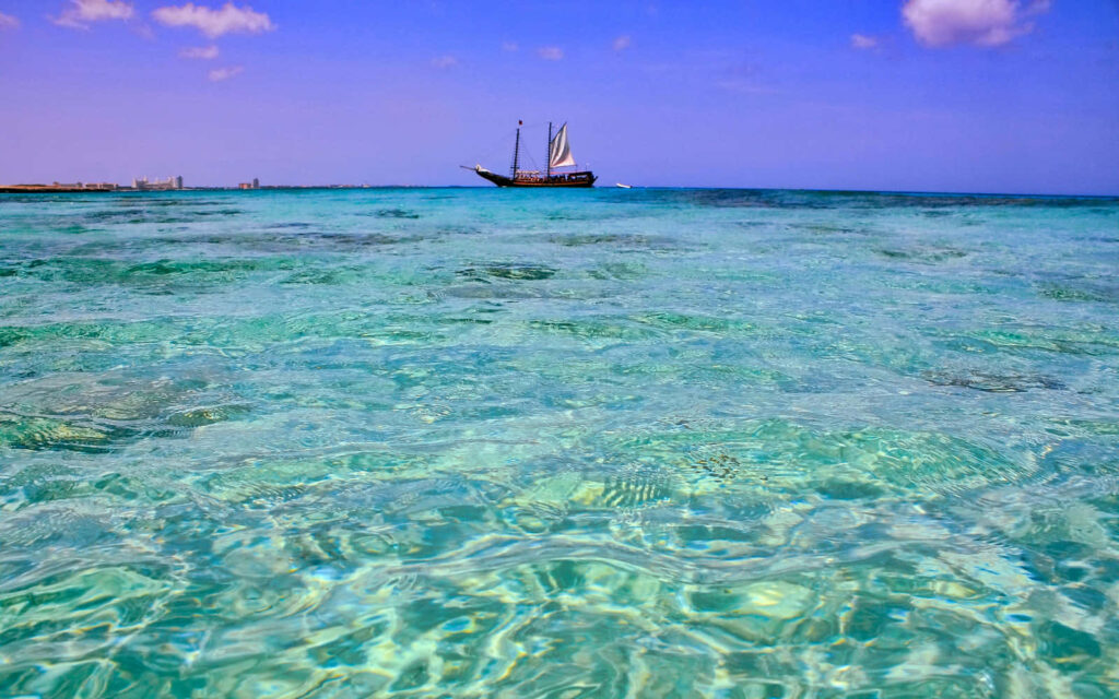 Tranquil Wallpaper: Serene Turquoise Waters & Sailboat Adventure