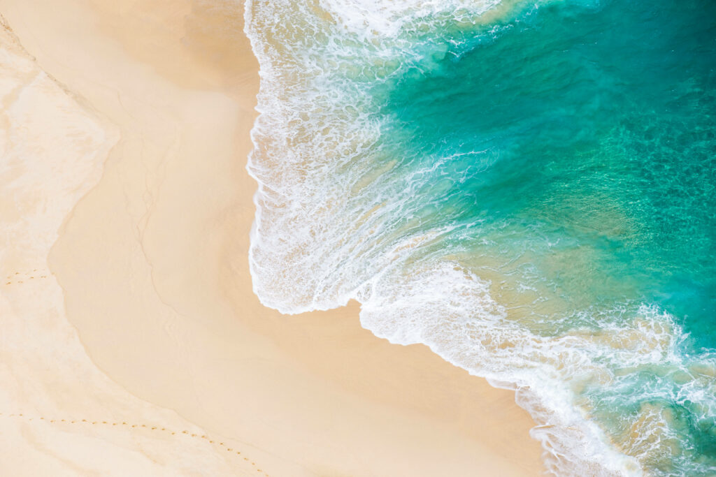 Serene Aerial Beach Wallpaper: Turquoise Waves & Sandy Shoreline