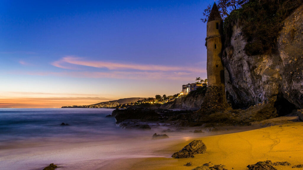 Twilight Beach: Unique Rock Formation & Coastal Sunset Wallpaper