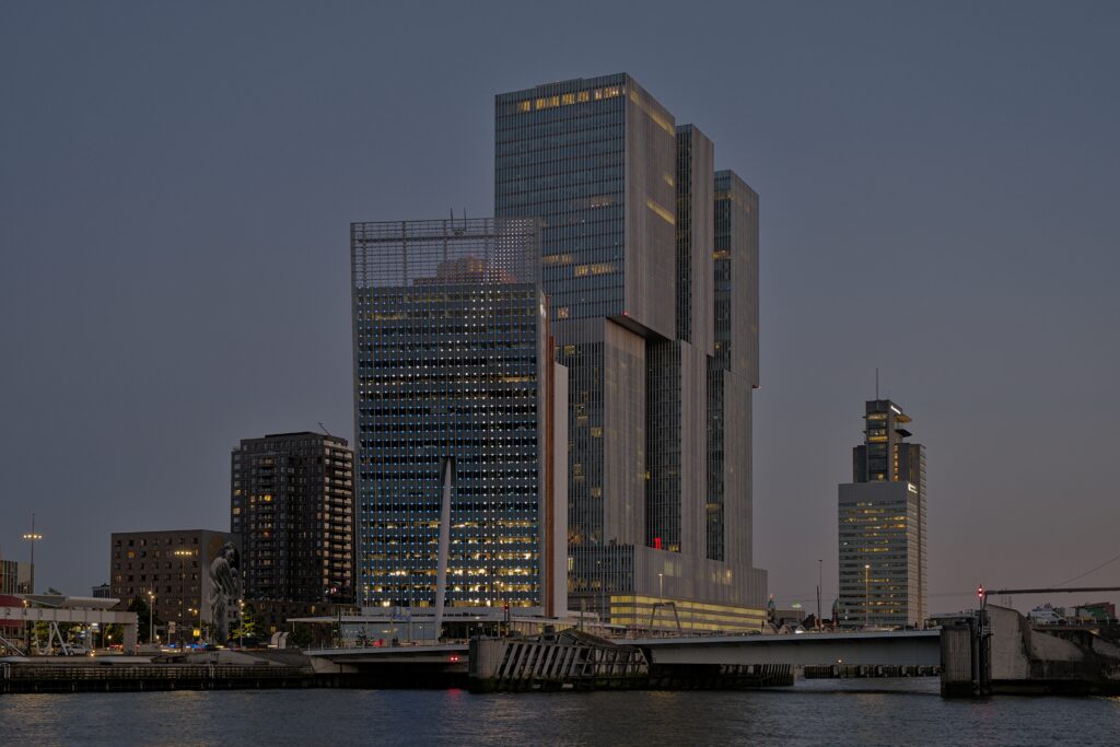 Twilight Cityscape Wallpaper: Serene Modern Buildings & Waterfront View