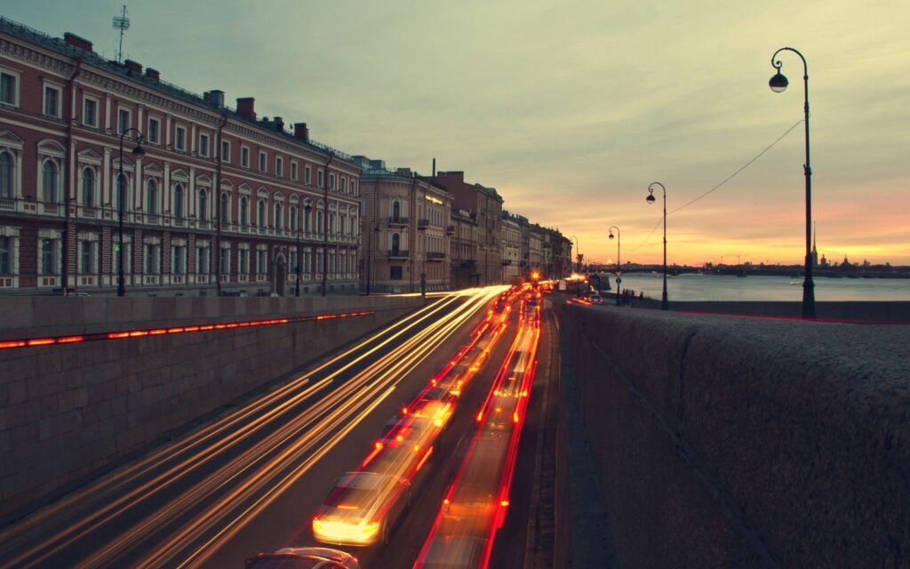 Twilight Cityscape Wallpaper: Serene Riverside Street at Night