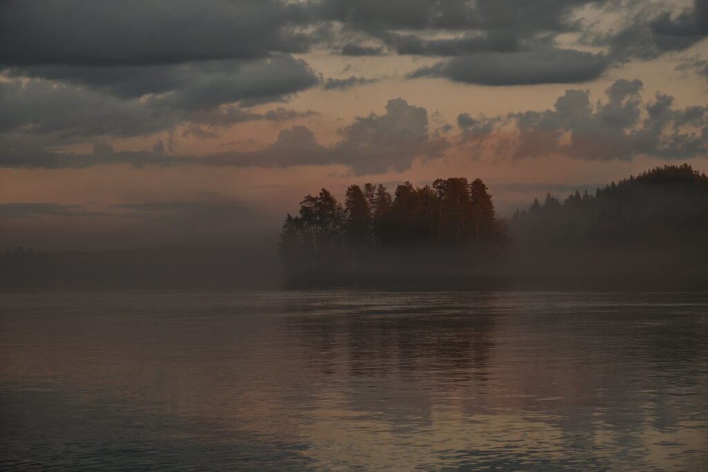 Serene twilight misty forest reflecting calm lake with warm and cool hues landscape wallpaper