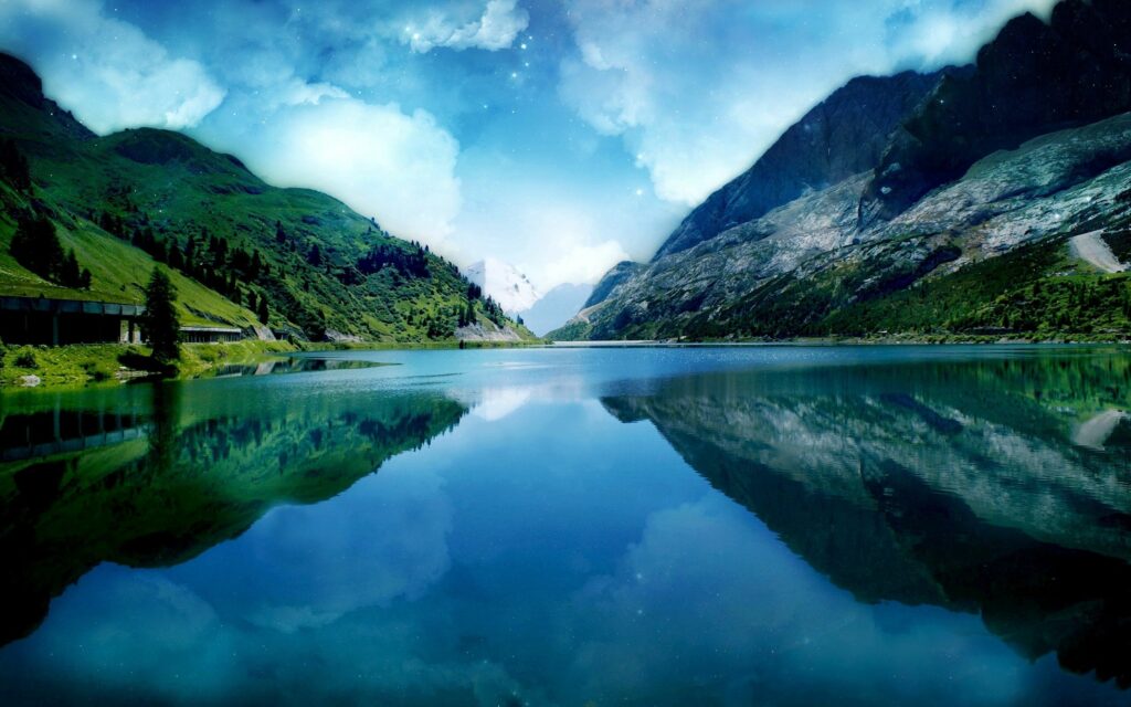 Serene twilight river reflecting dramatic mountains and starry sky with lush green coasts wallpaper
