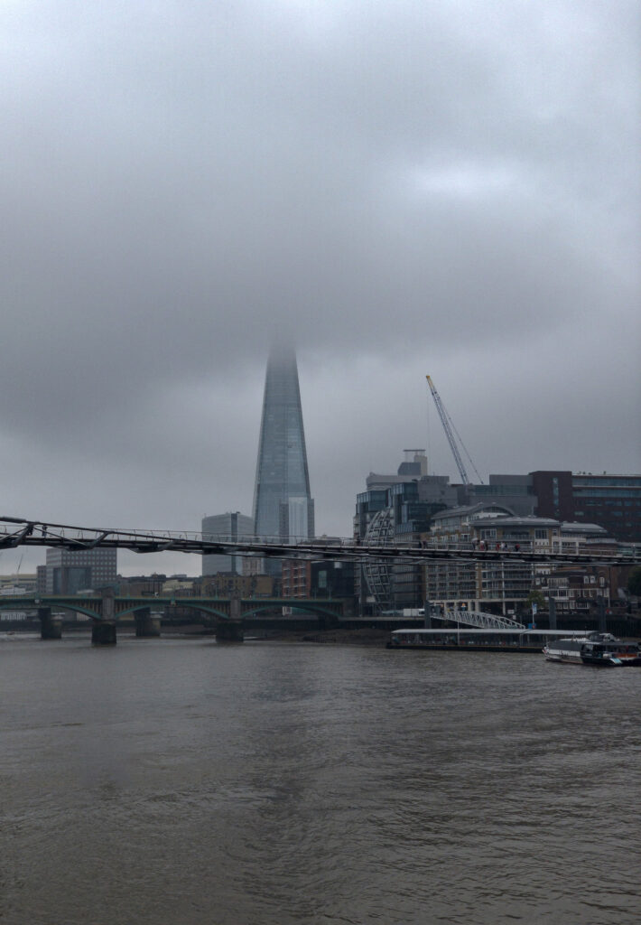 Serene Urban Wallpaper: River, Bridge, Skyscraper & Foggy Cityscape