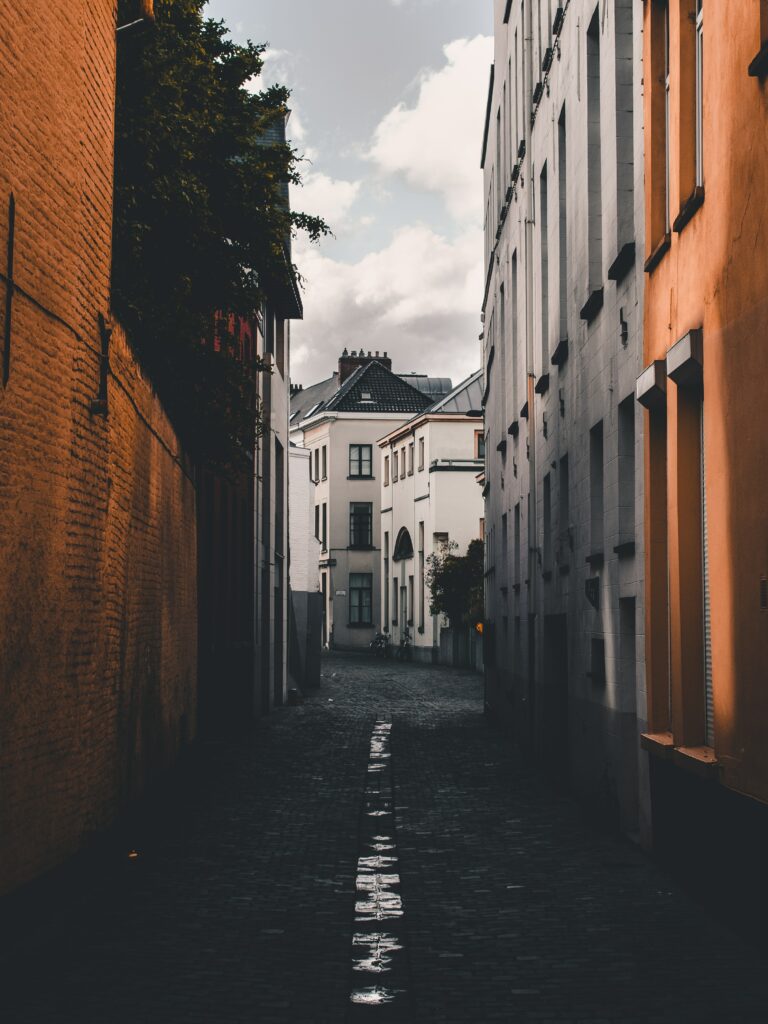 Serene Urban Architecture: Cobblestone Streets & Peaceful Sky Wallpaper