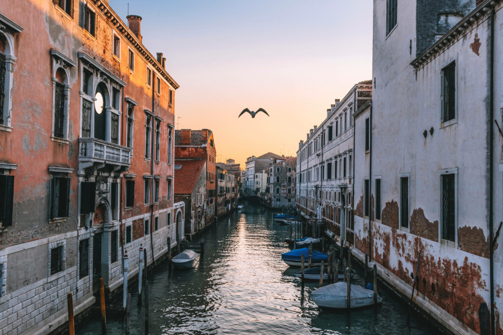 Peaceful Venice Canal Wallpaper: Pastel Buildings & Evening Sky