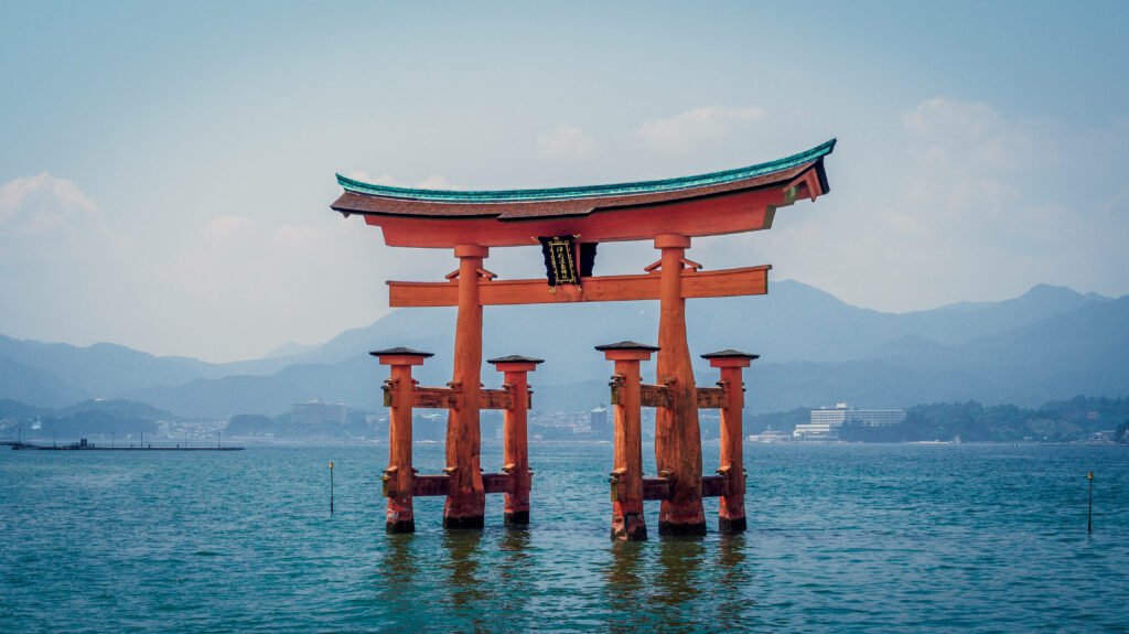 Serene Miyajima Wallpaper: Floating Torii Gate & Misty Mountains