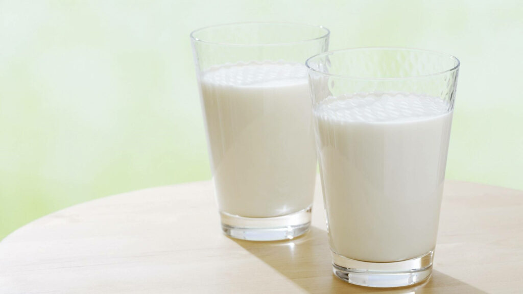 Serene Fresh Milk Wallpaper: Glasses on Light Wooden Table