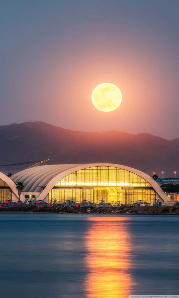 Serene Full Moon Wallpaper: Glowing Reflection Over Calm Waterfront