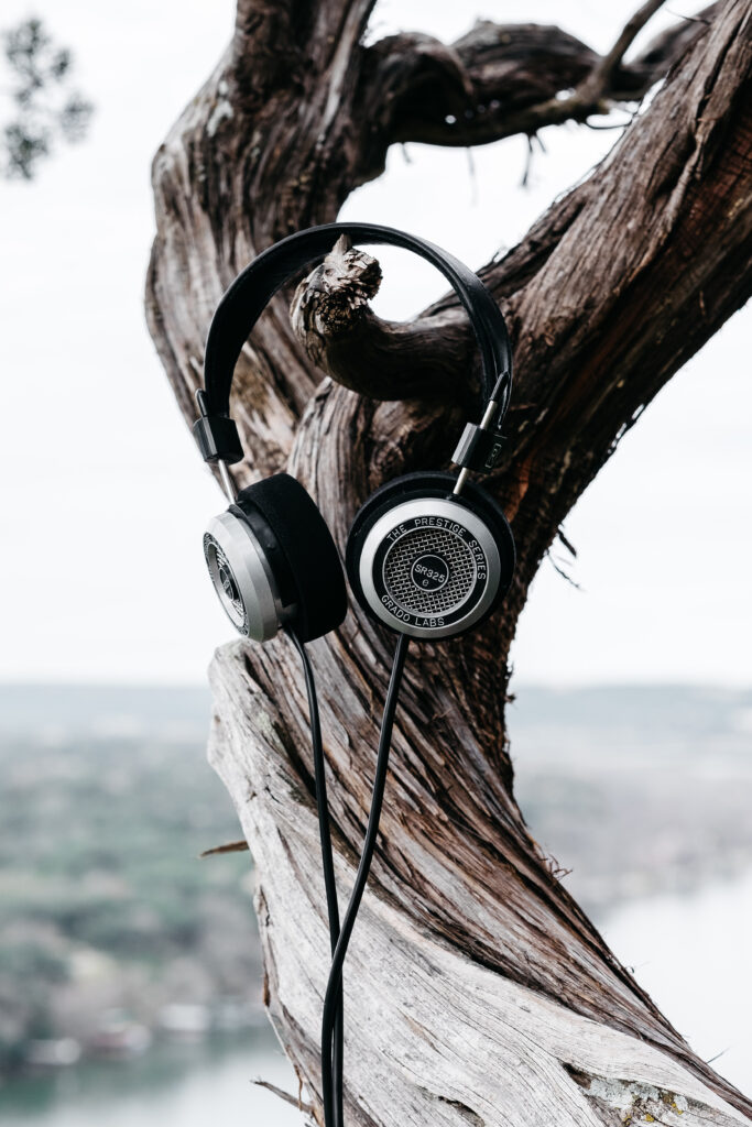 Nature-Inspired Wallpaper: Headphones on Tree Trunk Background