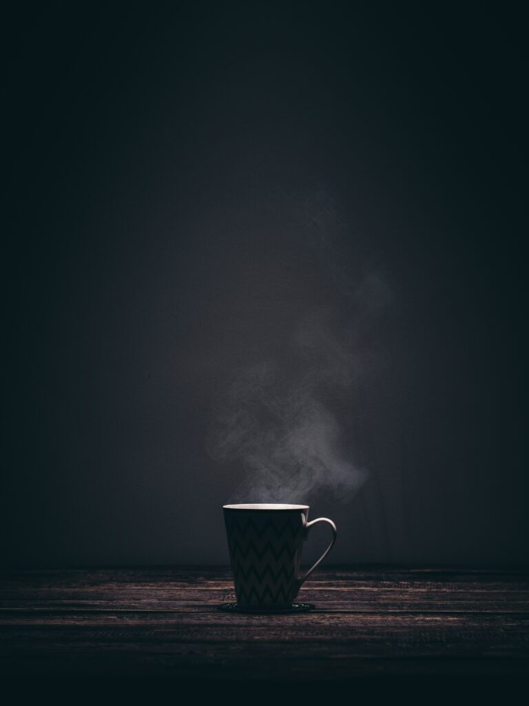 Serene Wallpaper: Steaming Mug on Rustic Table - Minimalist Design