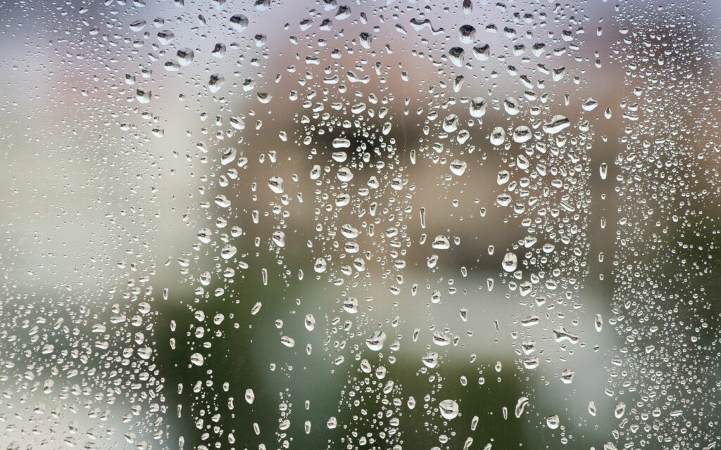Serene Water Drops Wallpaper: Soothing Glass Window Background