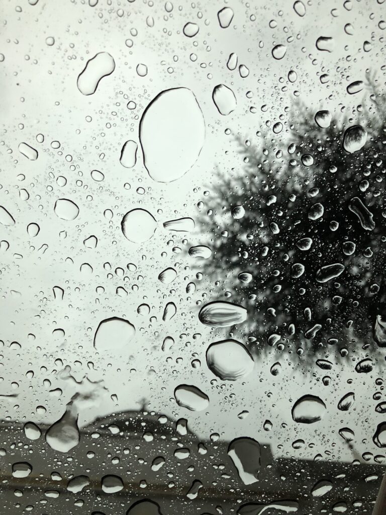 Serene Wallpaper: Transparent Water Droplets on Glass Surface