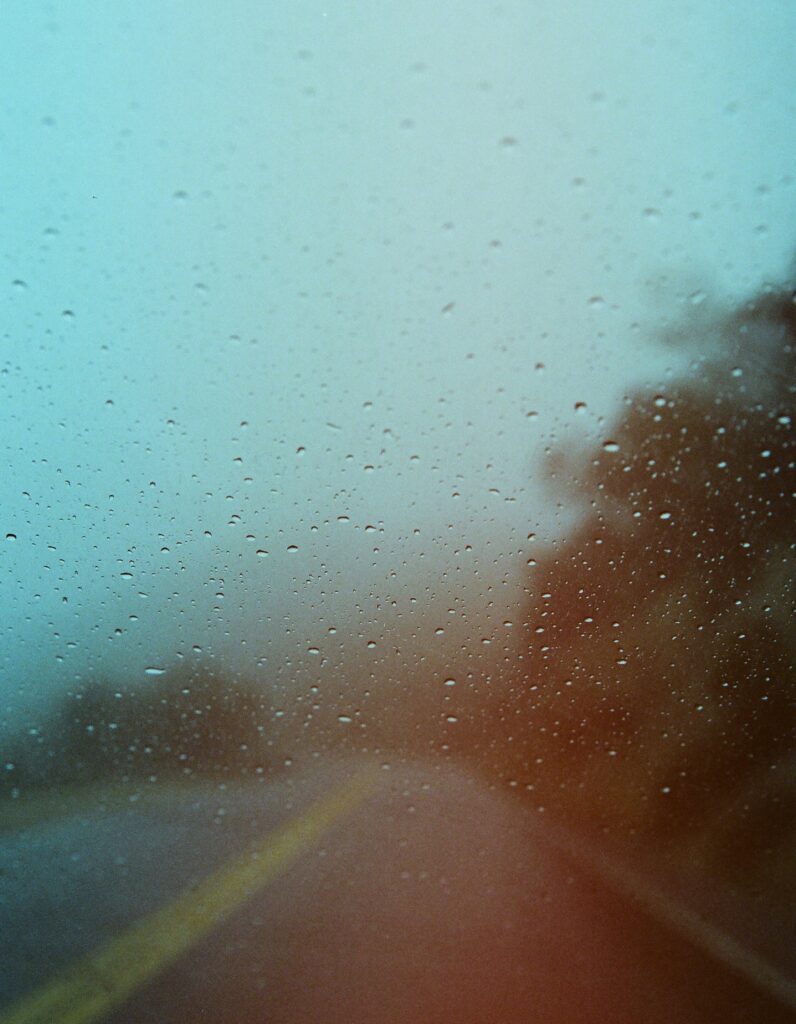 Serene Water Droplets Wallpaper: Blurred Road & Landscape Background