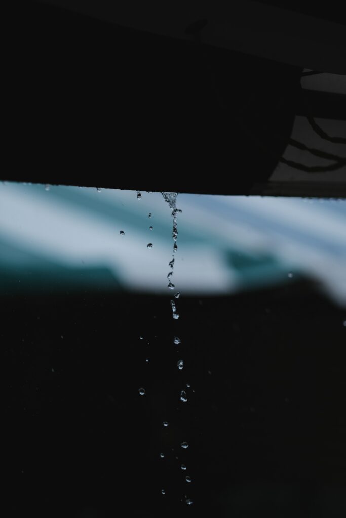Serene Rain Wallpaper: Tranquil Water Droplets in a Gentle Stream
