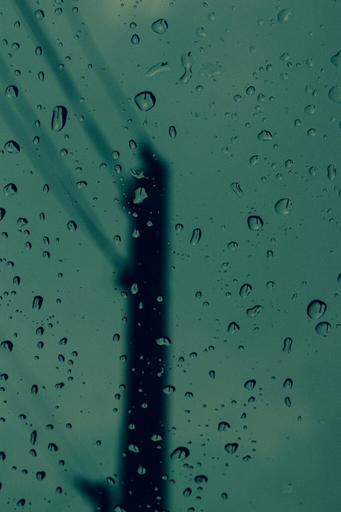 Serene Water Droplets Wallpaper: Calming Glass Reflection Background