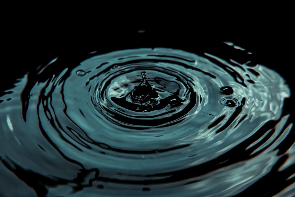 Serene Water Ripple Wallpaper with Intricate Patterns and Reflections