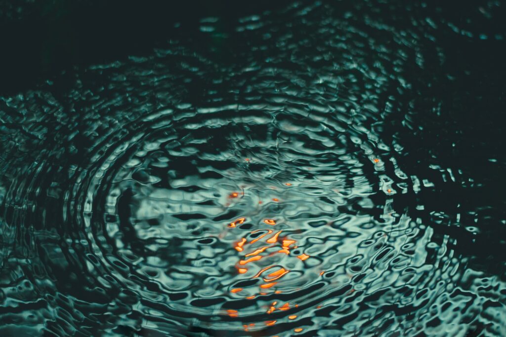 Tranquil Water Surface Wallpaper with Gentle Ripples and Glow