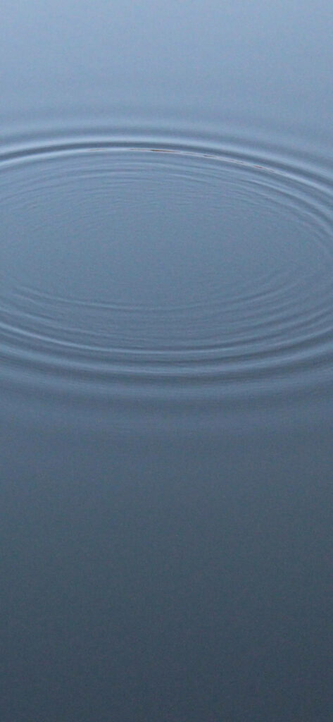 Serene Water Wallpaper: Minimalist Background with Calming Ripples