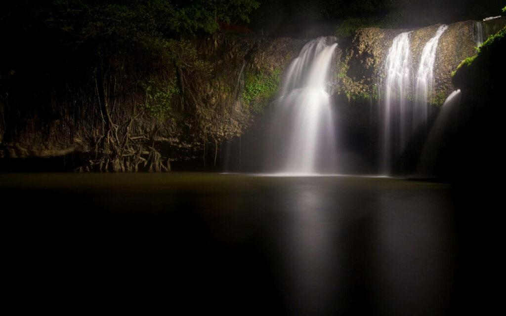 Serene Waterfall Wallpaper: Tranquil Cave and Lush Greenery Background