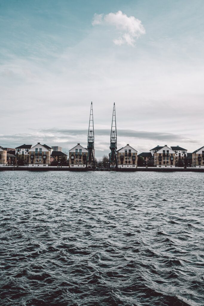 Serene Waterfront Cityscape Wallpaper with Charming Architecture