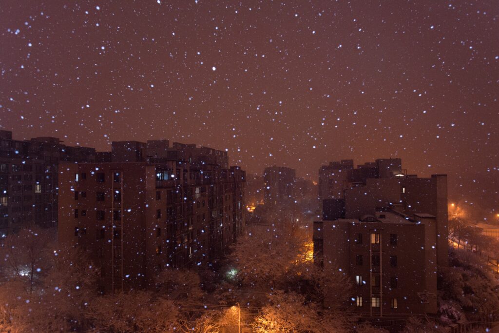 Serene Winter Cityscape Wallpaper: Aerial View with Snowy Atmosphere