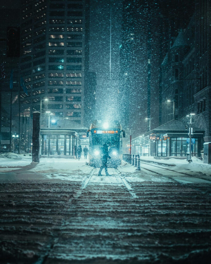 Serene Urban Winter Wallpaper: Train & Snowy Night City Scene