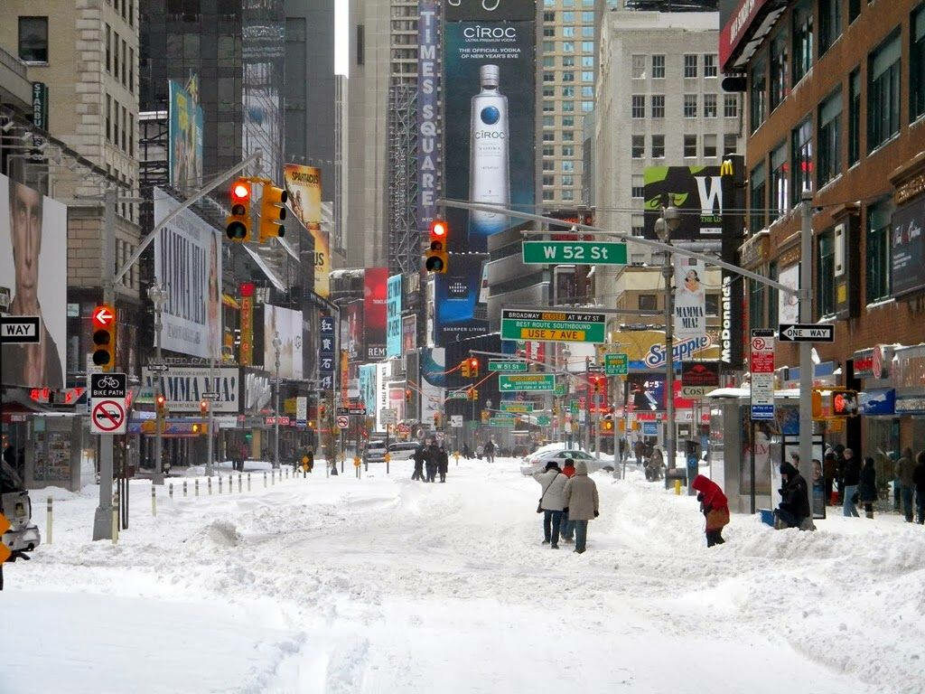 Serene Winter Times Square: Snowy Scene Wallpaper Background