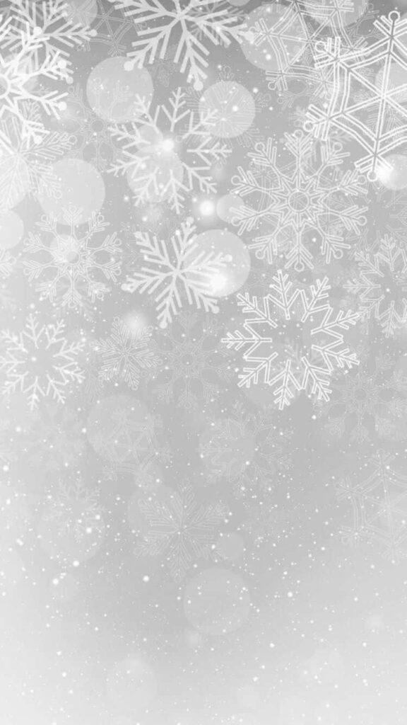 Serene Winter iPhone Wallpaper: Delicate Snowflakes on Gray Background