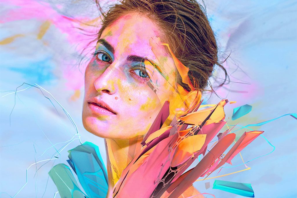 Digital art wallpaper of serene woman blended with 3D geometric shards and vibrant paint splatters