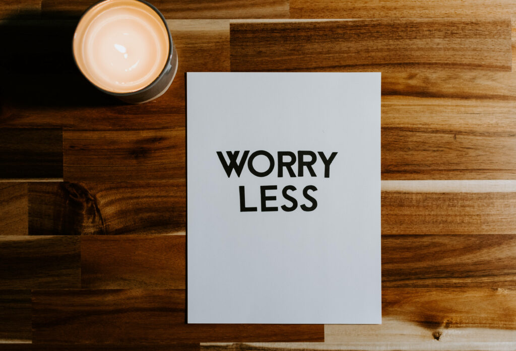 Worry Less Wallpaper: Serene Wood Background & Candle Glow