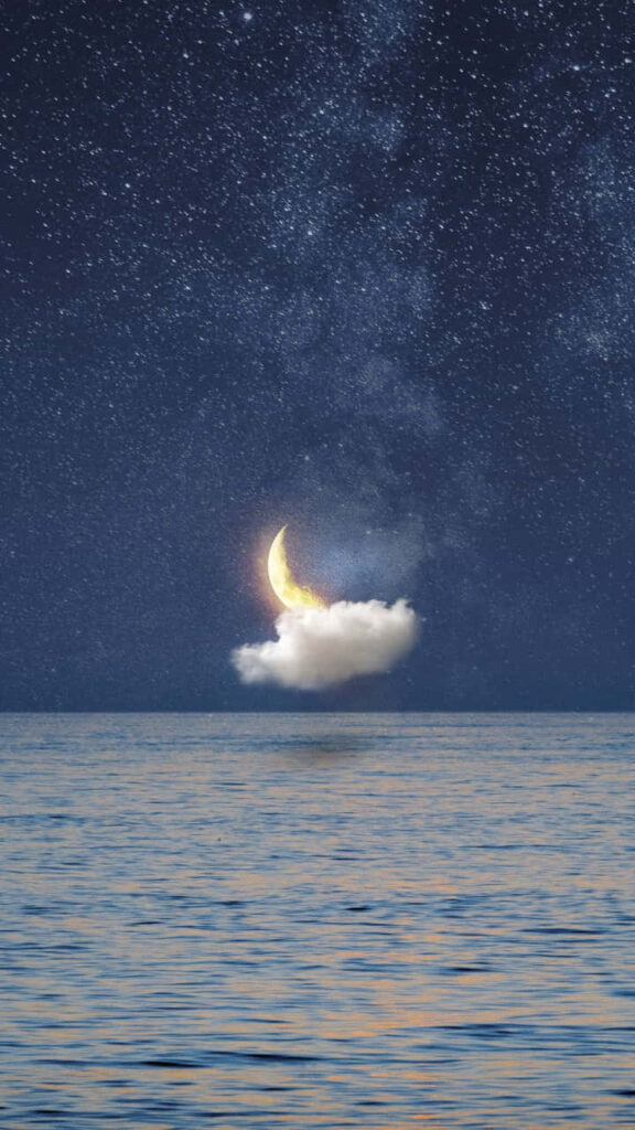 Serene iPhone Wallpaper: Glowing Crescent Moon Over Starry Ocean