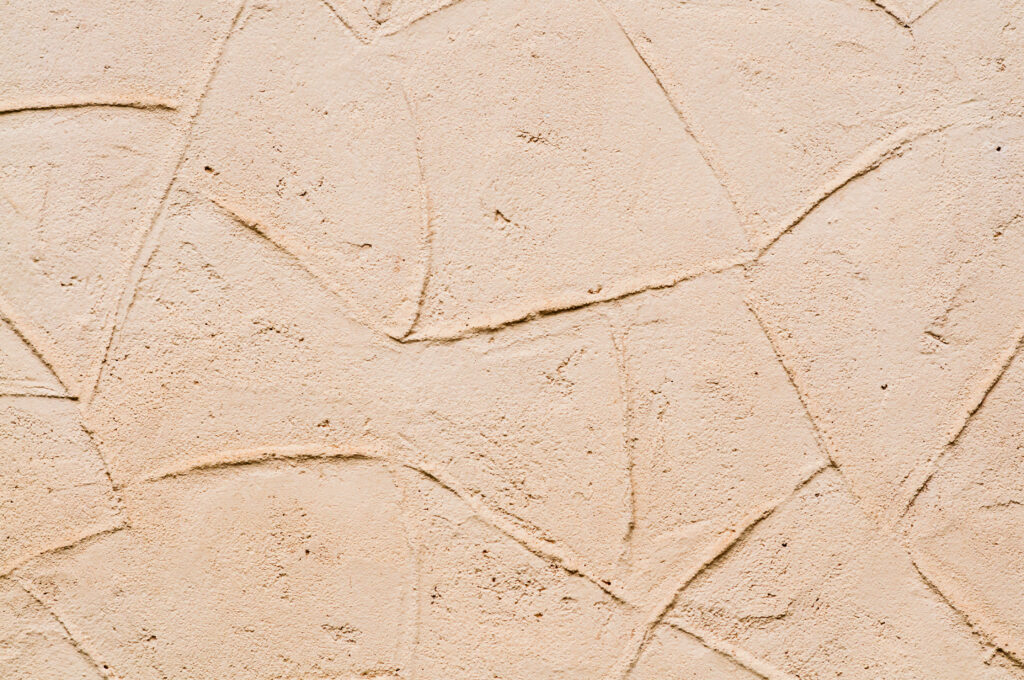 Sandy Hues: Captivating Aesthetics of a Textured Beige Wall Resembling Golden Sands Wallpaper