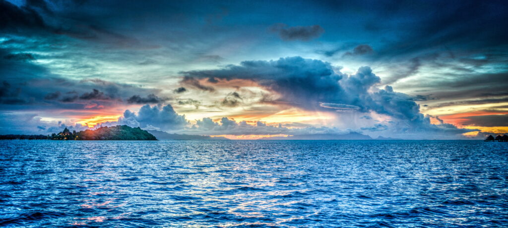Serenity Unveiled: A Captivating Sunset Across Bora Bora's Pacific Horizon Wallpaper
